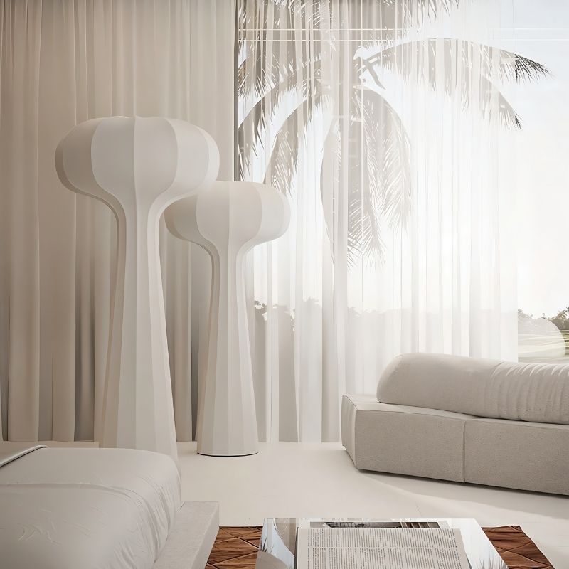 "Sculptural floor lamps with a modern minimalist design, placed in a contemporary living room setting with soft natural lighting, featuring a streamlined silhouette in high-quality material."
