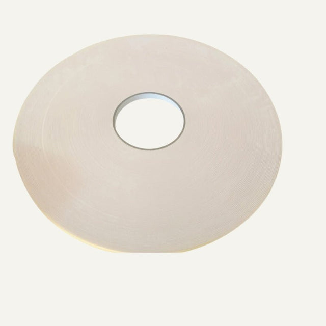 Close-up of adhesive tape roll used for mounting Hite PVC Wall Panels. Provides strong hold for easy and lasting wall installations.