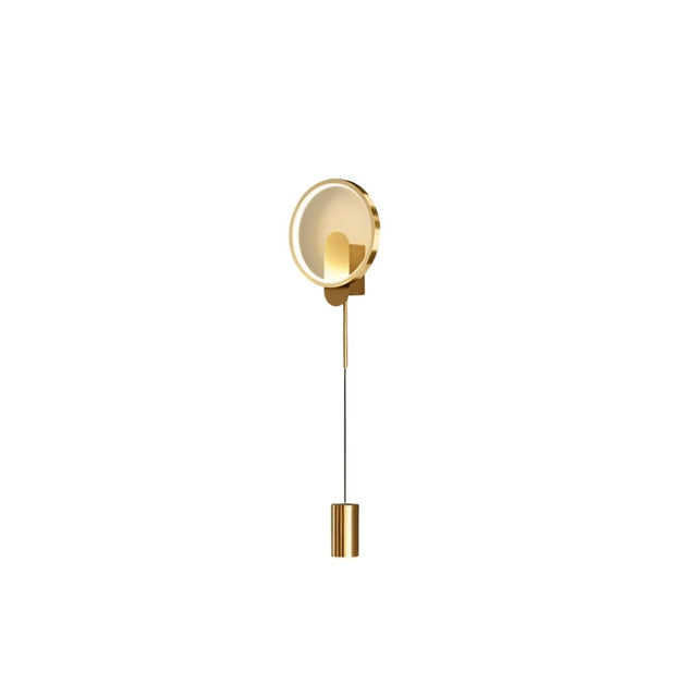 "A contemporary gold wall lamp with a circular acrylic diffuser and an adjustable cylindrical light source."