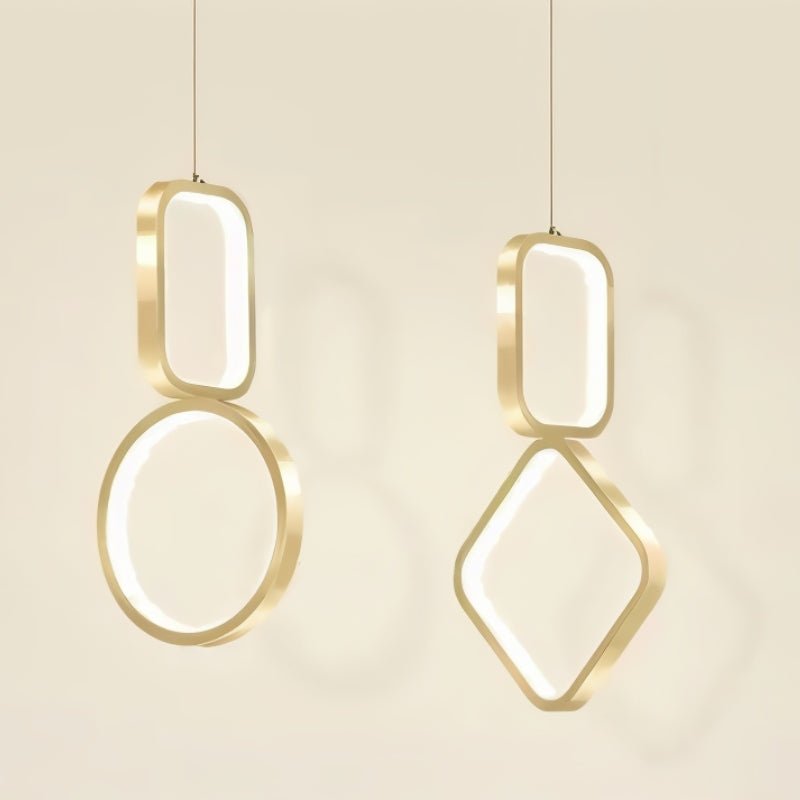 "Pair of geometric pendant lights with metal frames and acrylic diffusers, featuring circular and square shapes."