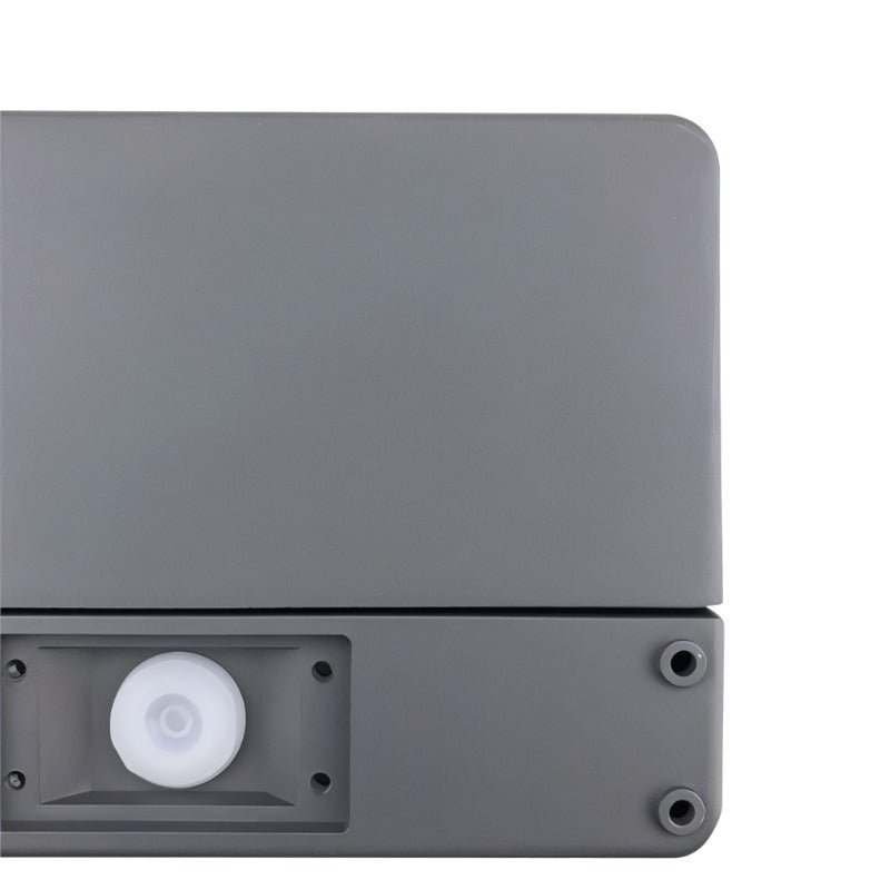 "Close-up of a minimalist rectangular outdoor wall lamp made of aluminum with a PC diffuser."