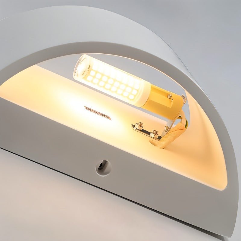 "Close-up detail of a modern curved rectangular gypsum wall lamp showcasing the smooth matte finish and the light source casting a warm glow."
