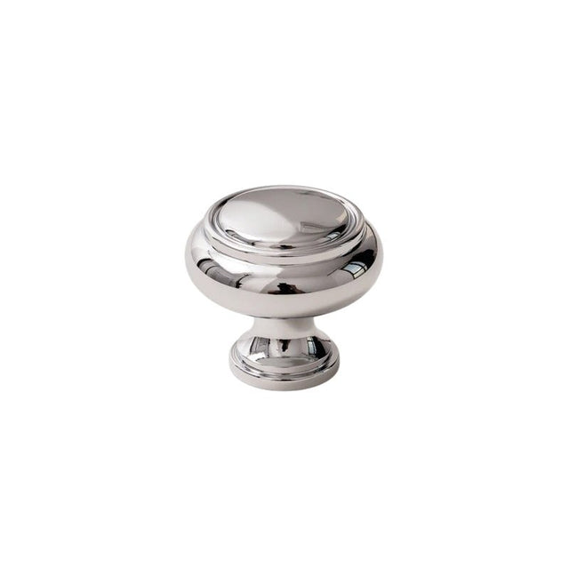 "A polished chrome brass cabinet knob with a classic, elegant design, isolated on a white background."