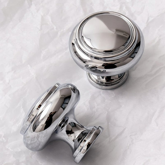 "Polished chrome Victorian brass knobs with an elegant, timeless design for luxury interiors."