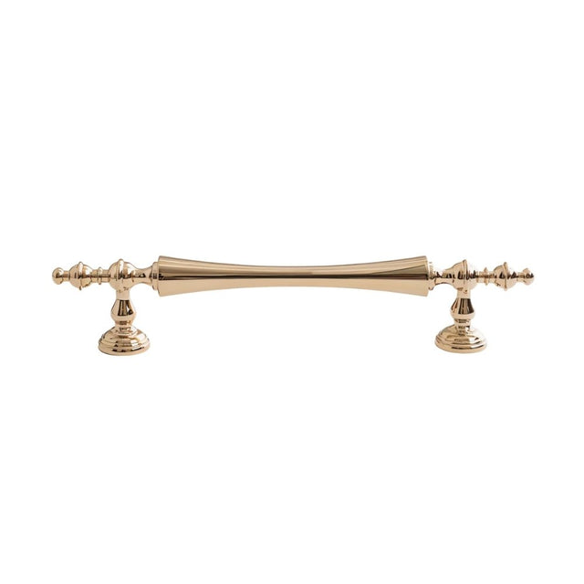 "Brass pull bar handle with a tapered spindle design and intricate finials on a white background."