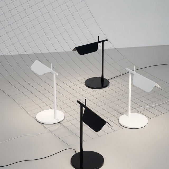"Minimalist black and white table lamps with adjustable shades, crafted from metal for contemporary interiors"