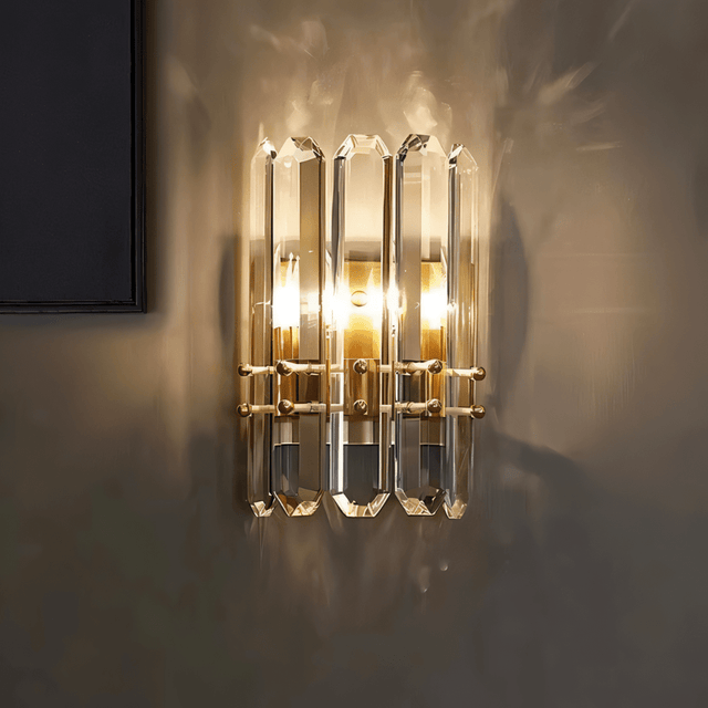 Close-up of Lenvo Crystal Copper Wall Light glowing warmly on a dark wall, highlighting its crystal and copper elegance.