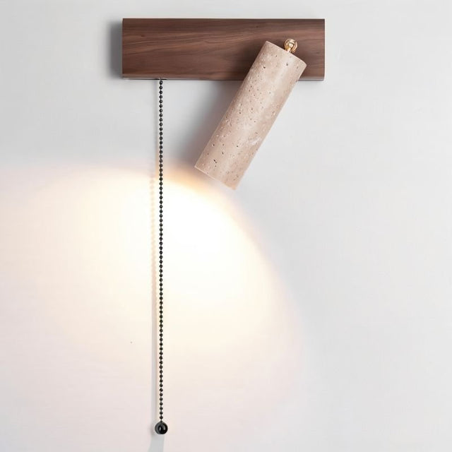 "Lindr bedside lamp, wall-mounted in a bedroom, showcasing natural wood and stone materials with a warm, diffused light."