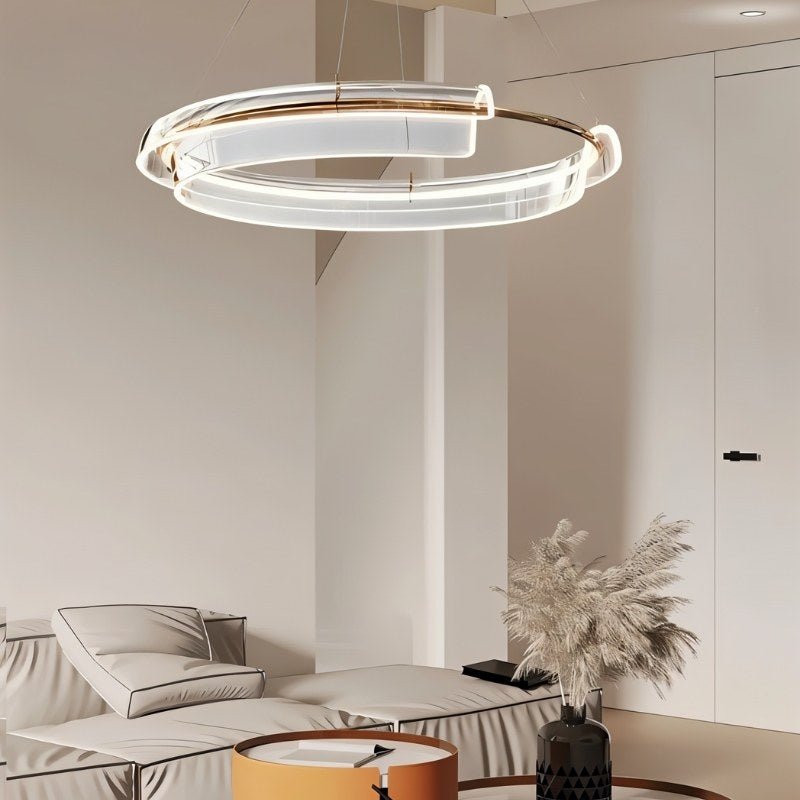 "An asymmetric dual-ring LED chandelier with iron and acrylic in a modern living room."