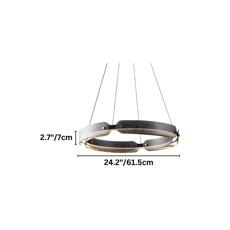 "A smaller, circular, segmented chandelier with a ring design, made of iron and glass, suspended by thin cables."