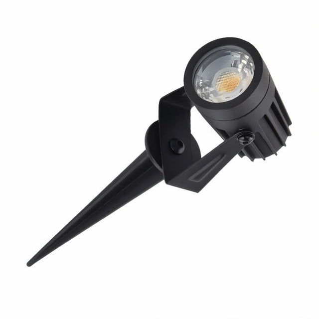 "Angled view of an outdoor spotlight with spike mount, aluminum body, and adjustable head."