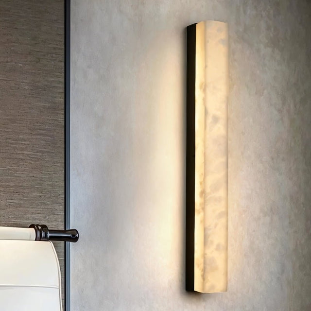 "A New Chinese wall lamp featuring a rectangular panel of translucent marble, providing a soft, ambient glow and showcasing the stone's natural veining."