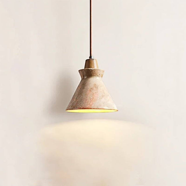 Menra Pendant Light casting warm glow, crafted from natural stone and wood, ideal for modern or Wabi-Sabi inspired interiors.