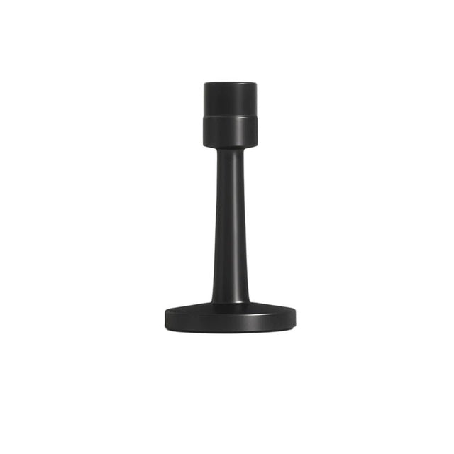 "Sleek, cylindrical door stop in matte black zinc-alloy with a sturdy base and extended arm to prevent doors from hitting walls in modern interiors."