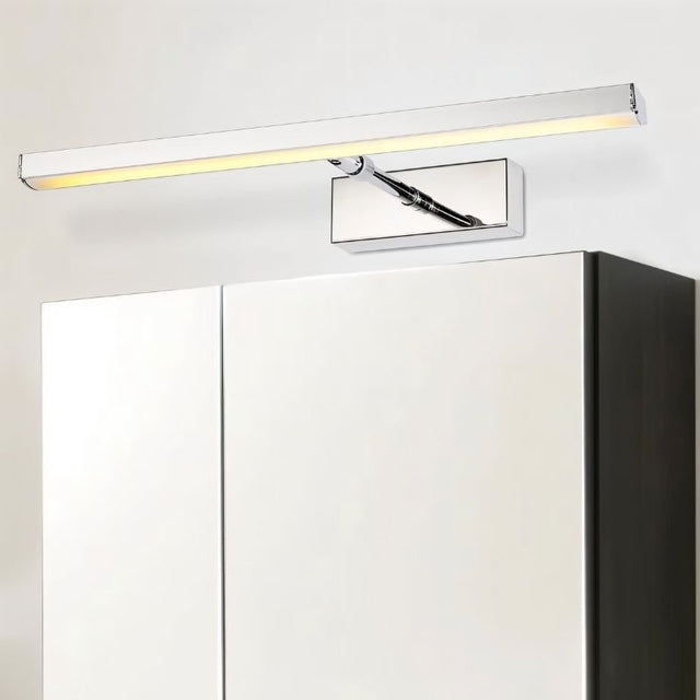 "Modern bathroom featuring a Mirvia Wall Lamp above a mirror, complemented by a cabinet, showcasing sleek design and LED efficiency."