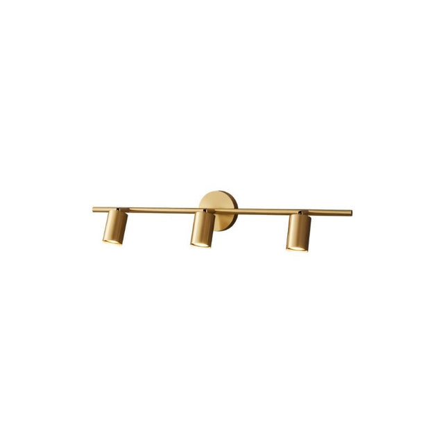 "A modern brass bathroom vanity light with three adjustable heads mounted on a circular base, isolated on a white background."