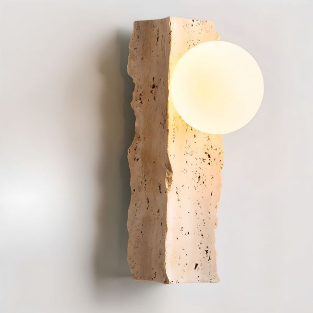 "minimalist wall lamp with raw travertine base and frosted glass globe, warm ambient lighting fixture"