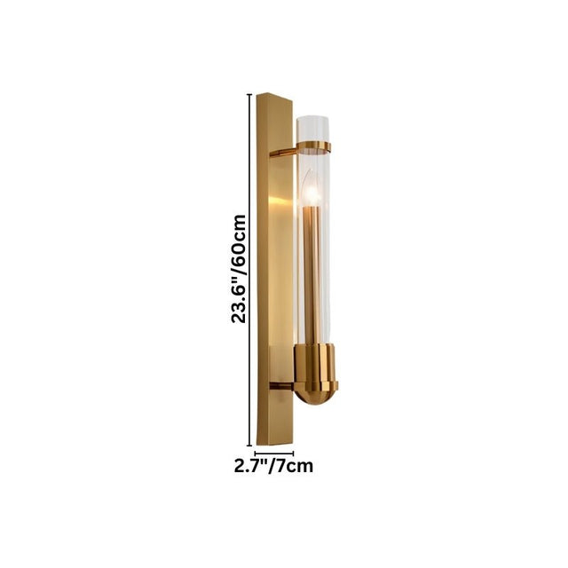 "A modern brass wall lamp with a rectangular base and a cylindrical glass shade, shown with dimensions on a white background."