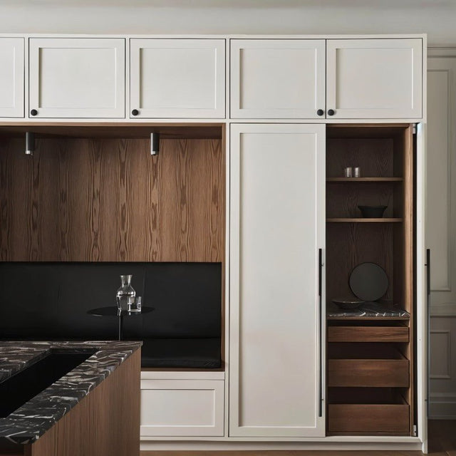 "Minimalist aluminum pull bar handles and Knobs on white cabinet doors in a modern kitchen setting."