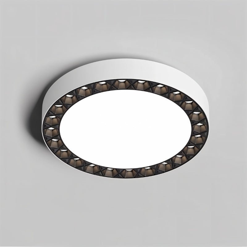 "A close-up of the Nival ceiling light showcasing its intricate pattern around the edges, made from durable acrylic and aluminum, offering a sophisticated, modern look for contemporary interiors."