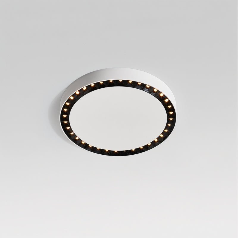 "The Nival ceiling light’s sleek, circular design with black accent details is perfect for modern living spaces, crafted with durable acrylic and aluminum for reliable lighting."