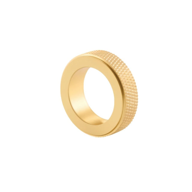 "A gold brass cylindrical knob with a knurled texture, isolated on a white background."