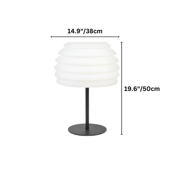 "A white layered table lamp with dimensions marked, showing the wave-like design and soft light diffusion."
