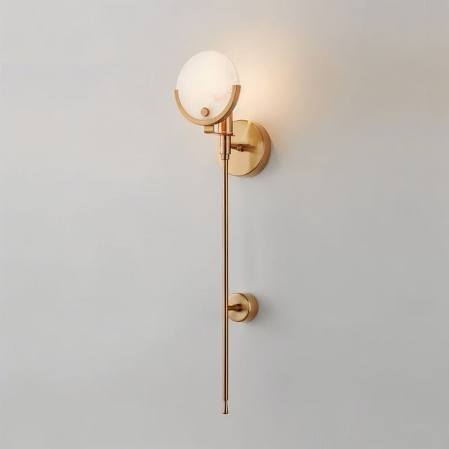 "modern brass wall lamp with alabaster globe and elongated rod, elegant lighting fixture for interiors"