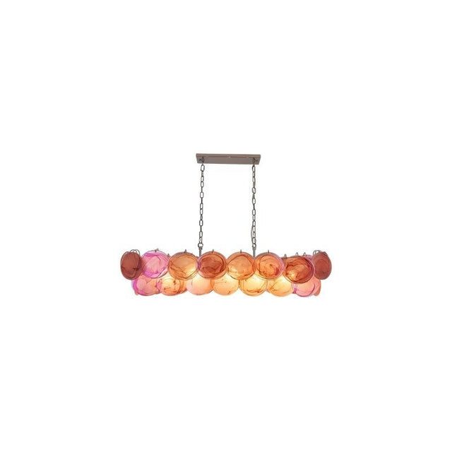 "A modern, rectangular chandelier with cascading pink and iridescent glass discs, suspended by chains."