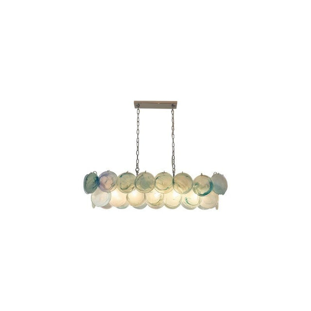 "A modern, rectangular chandelier with cascading green and iridescent glass discs, suspended by chains."