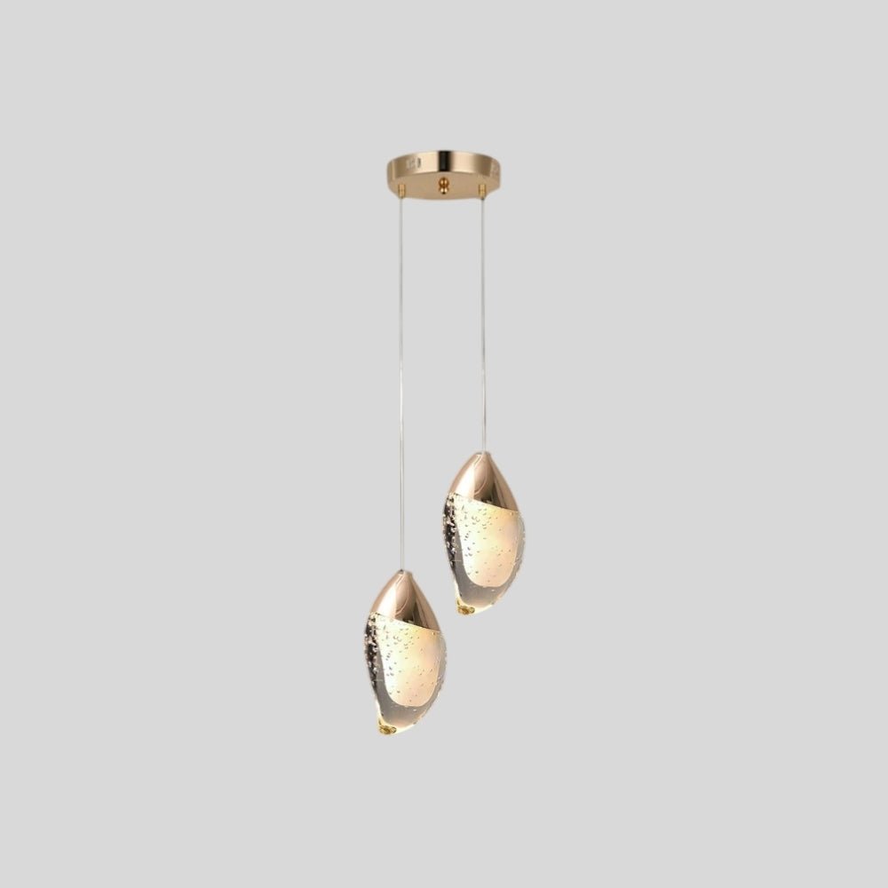 "Pair of modern pendant lights with fluid crystal forms and metal tops, isolated on a white background."