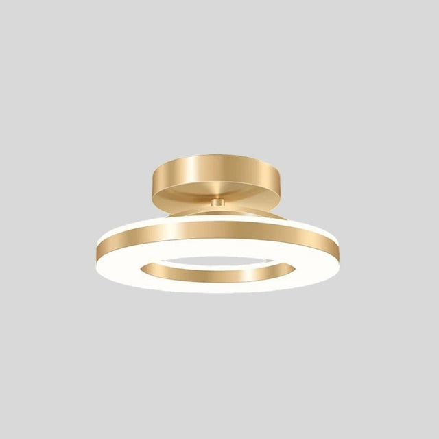 "Modern circular ceiling light with gold dual-ring design, illuminated, isolated on a gray background."