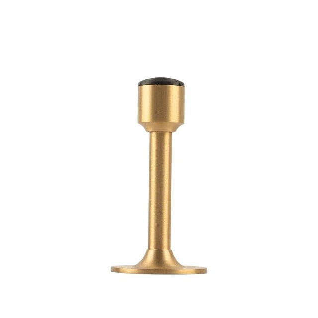 "Sculpted brass door stop with a sleek, tapered silhouette, polished finish, wide stable base, and magnetic hold, designed to prevent wall damage."