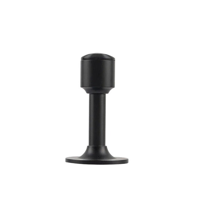 "Sculpted brass door stop with a sleek, tapered silhouette, matte black polished finish, wide stable base, and magnetic hold, designed to prevent wall damage."