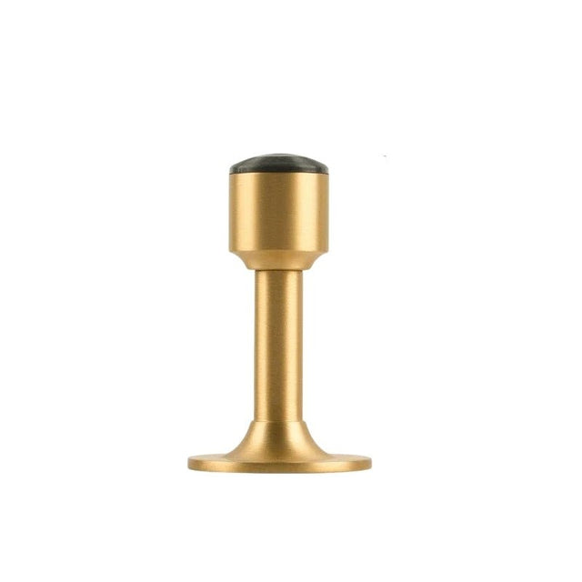 "Sculpted brass door stop with a sleek, tapered silhouette, polished finish, wide stable base, and magnetic hold, designed to prevent wall damage."