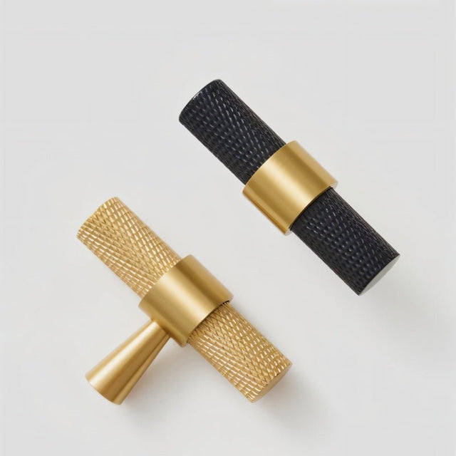 "Precision-crafted brass knurled pull bar handles in black and gold finishes with a cylindrical shape and sleek metallic look."