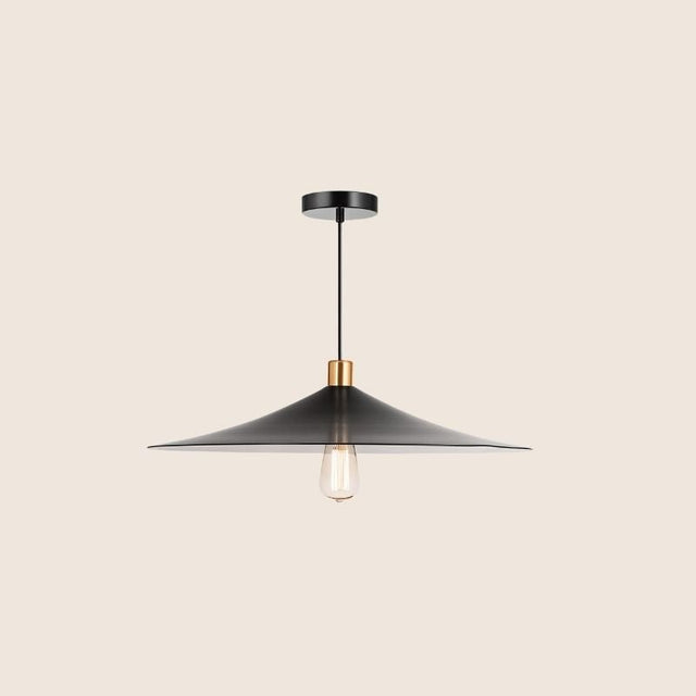 "Minimalist pendant light featuring a black conical shade with a gold accent, made from metal for contemporary or industrial spaces."