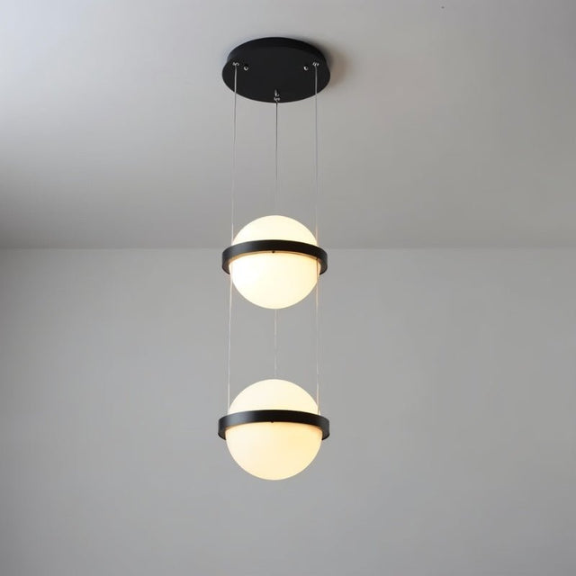 "Modern chandelier with two spherical frosted glass diffusers encased in iron bands, suspended by thin cables."