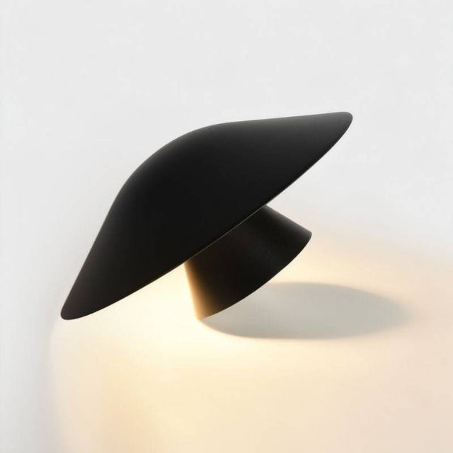 Side view of the Rochi Wall Lamp in black aluminum, highlighting its sculptural, asymmetrical design and integrated LED lighting.