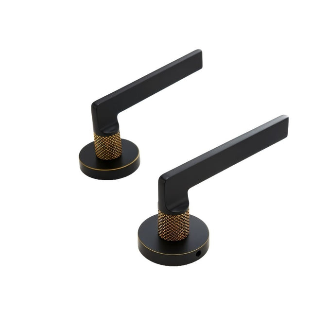 Pair of Sabaat Handles in matte black with gold knurled grips, ideal for double door interior installations.