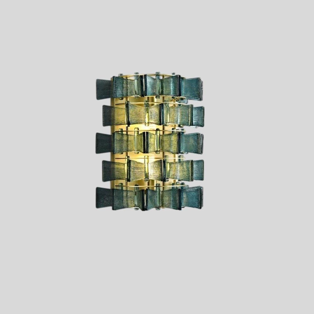 "Isolated iron Salane wall lamp with layered blue glass panels on a light grey background, full view."