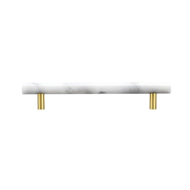 "A white marble pull bar with polished brass hardware, ideal for contemporary cabinetry."