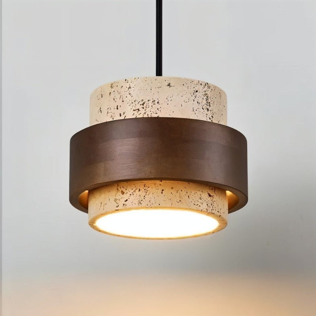 "A modern cylindrical pendant light featuring natural stone and dark wood, hanging against a light background."