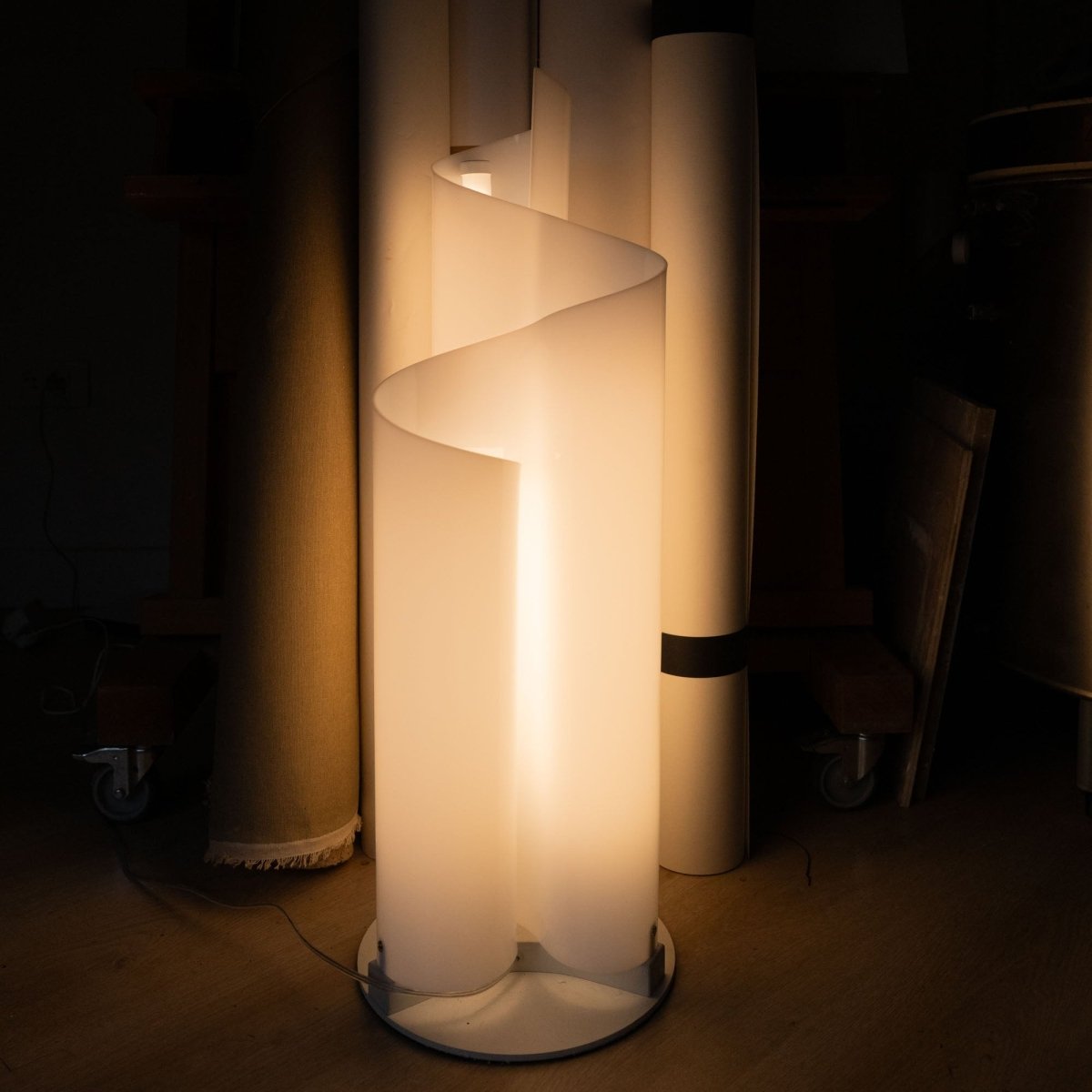 Close-up of the Stellora Table Lamp's spiral acrylic structure glowing warmly, highlighting its integrated LED and modern design.