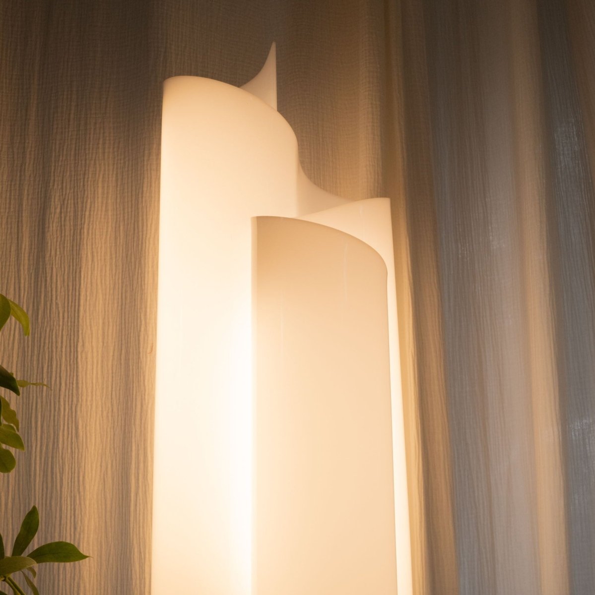 Upper section of Stellora Table Lamp showing layered spiral acrylic panels, ideal for contemporary ambient lighting setups.