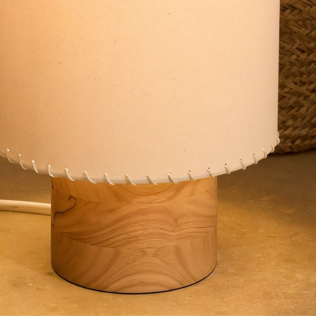"Close-up of the Svetlina floor lamp’s wood base, highlighting its smooth, natural texture and sturdy construction."