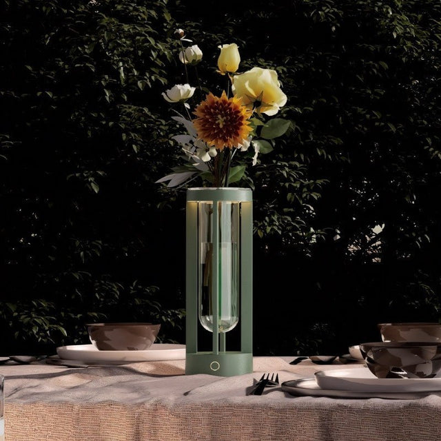Green Svetu Waterproof Rechargeable Pendant Table Lamp on an outdoor dining table, enhancing evening ambiance with LED lighting and floral arrangement.