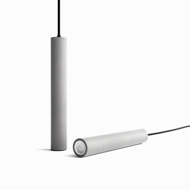 "Two gray cylindrical pendant lights, one hanging vertically and one lying horizontally, on a white background."