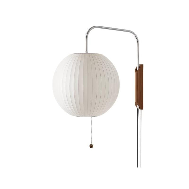 "A minimalist, modern wall lamp with a round silk shade, providing a soft, ambient light."