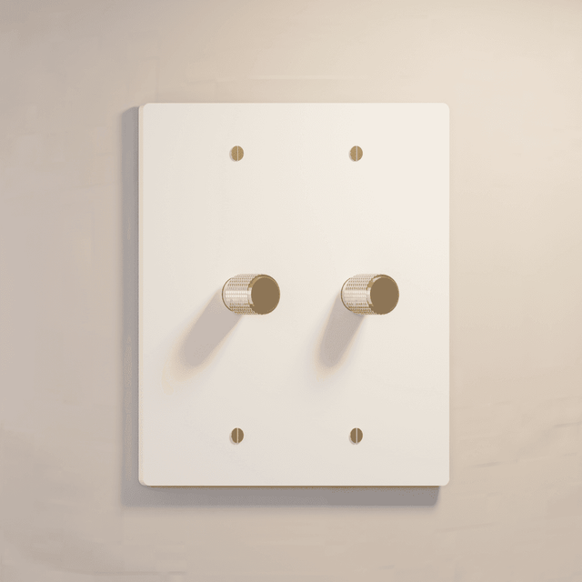 Two-gang white rotary dimmer switch with gold accents, ideal for clean and elegant lighting control.